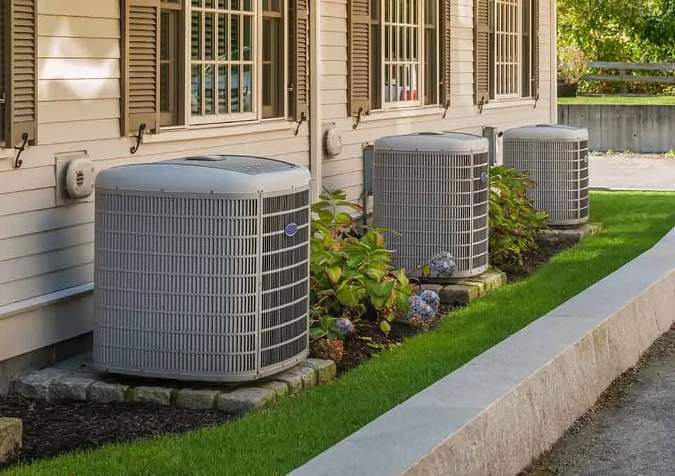 Love Home Services technician checking an air conditioner for a La Verne home Love Home Services technician checking an air conditioner for a La Verne home