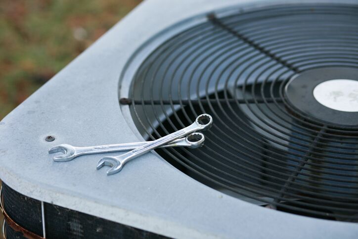 Technician servicing an air conditioner in Glendora, CA Technician servicing an air conditioner in Glendora, CA